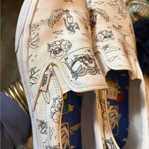 Vans White Graphic Slip-On Sneakers
